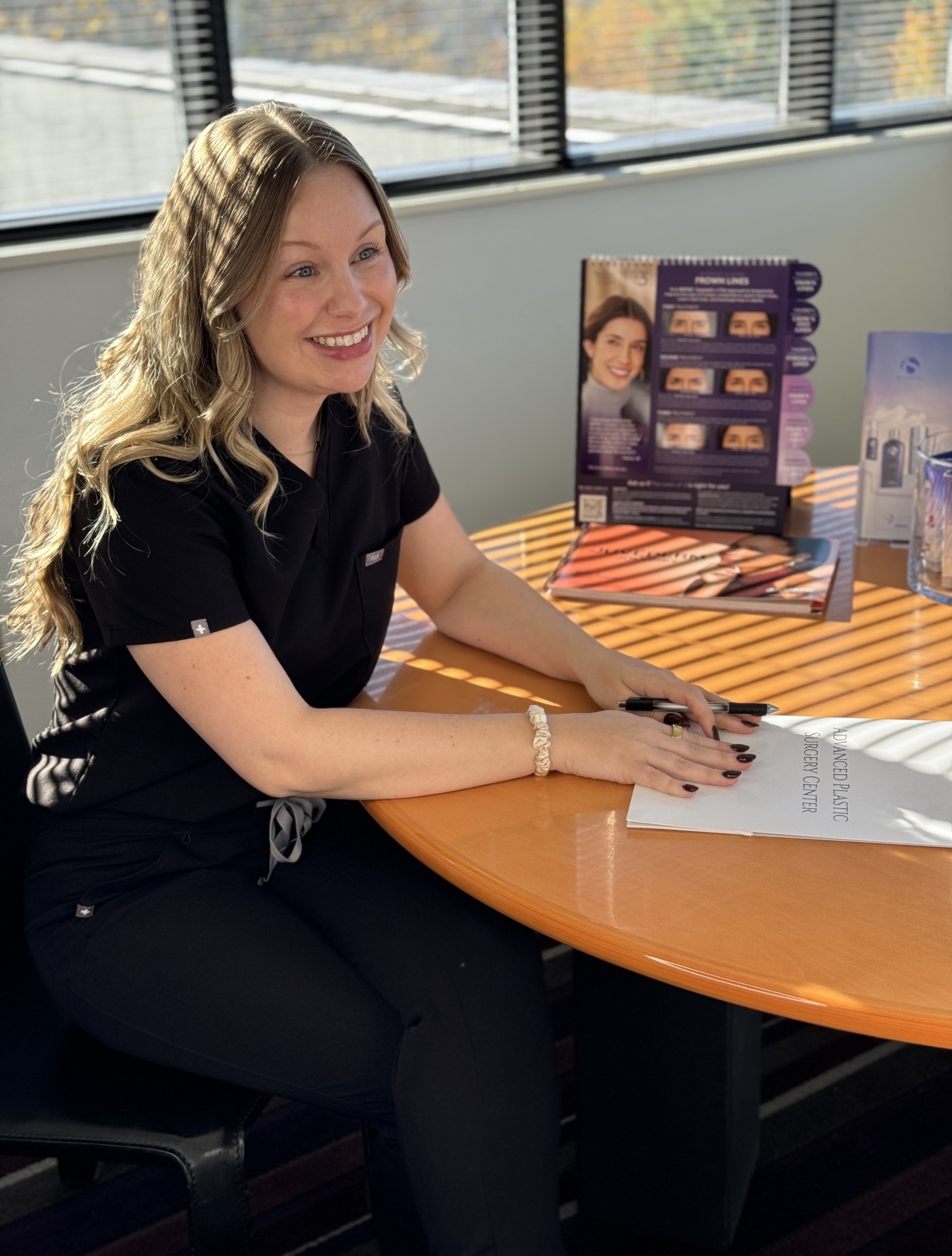 Photo of Ashley holding patient resources