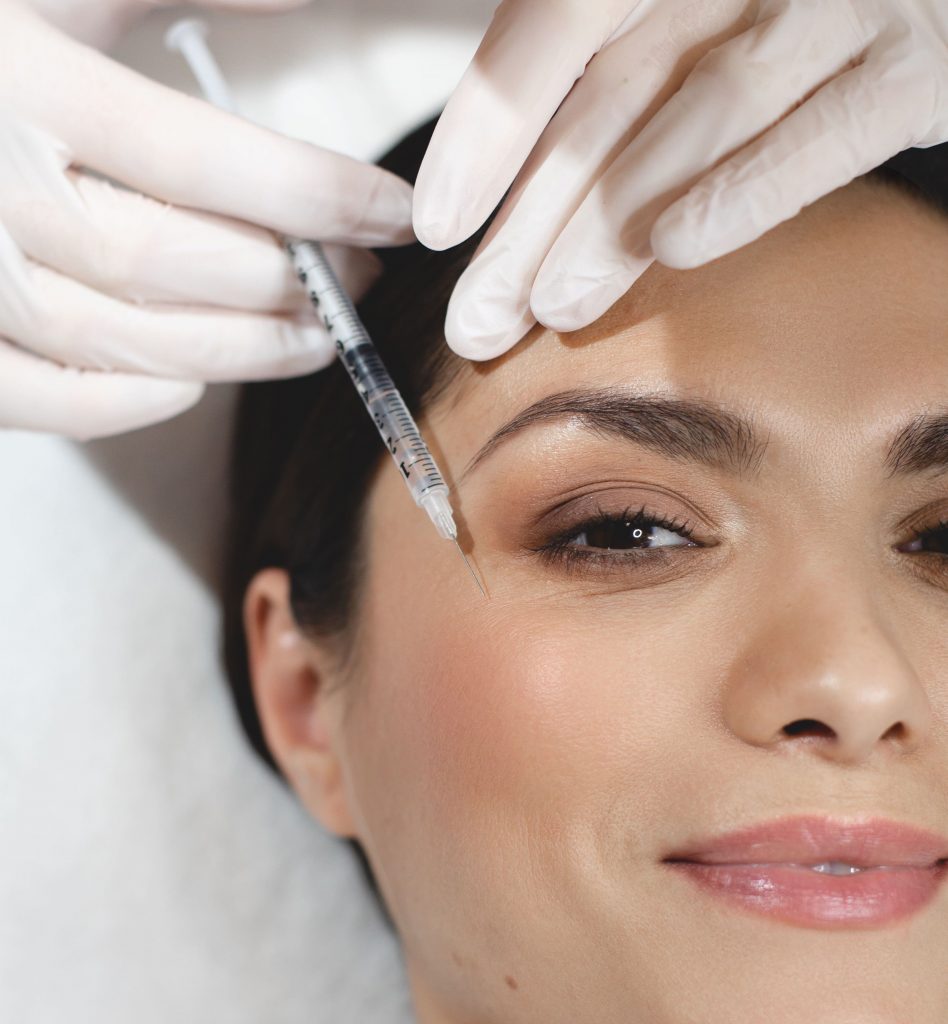 Photo of a woman getting BOTOX® Cosmetic injections near her eye for crow's feet