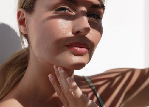 Photo of a woman with a beautiful face that is slightly covered in shadow