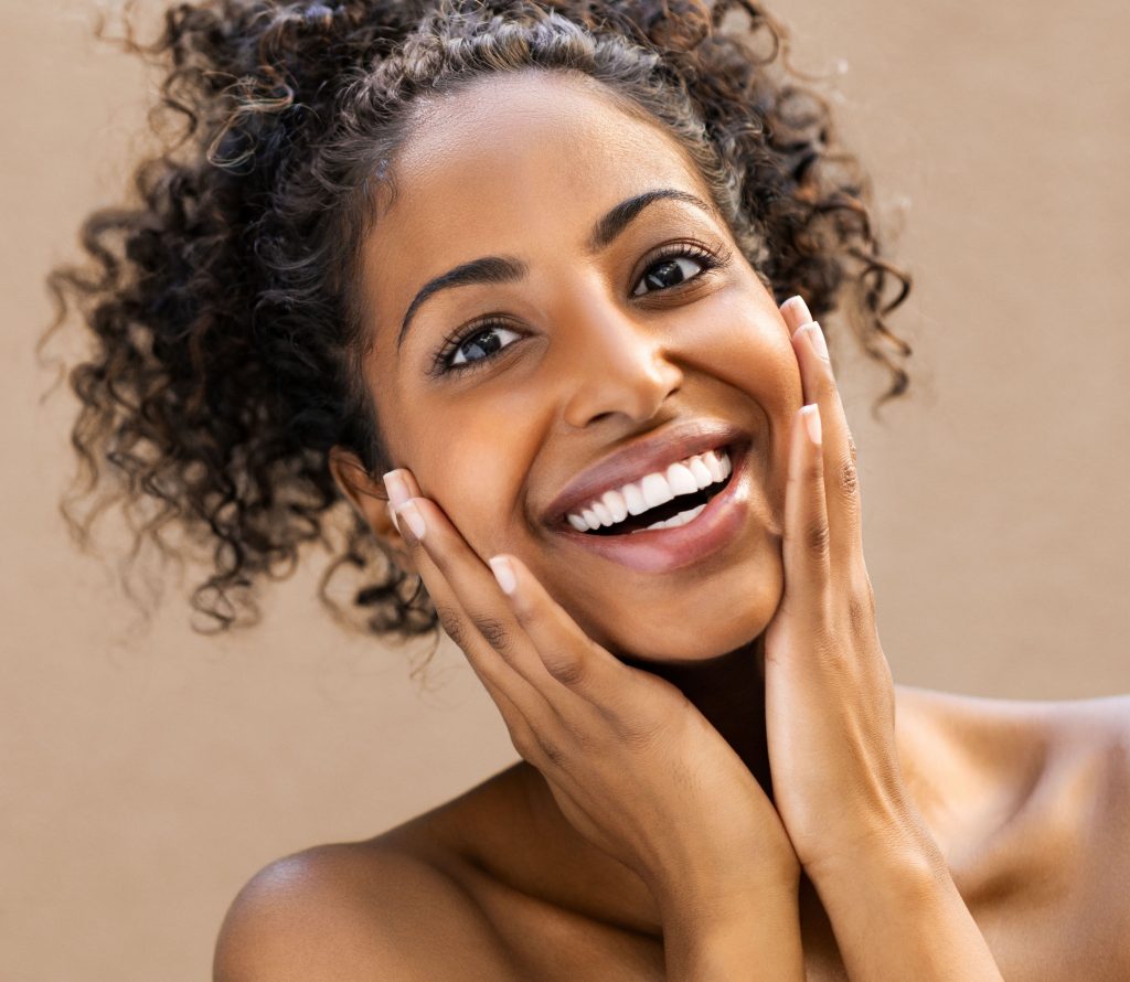 Photo of a woman who is very happy with her amazing skin
