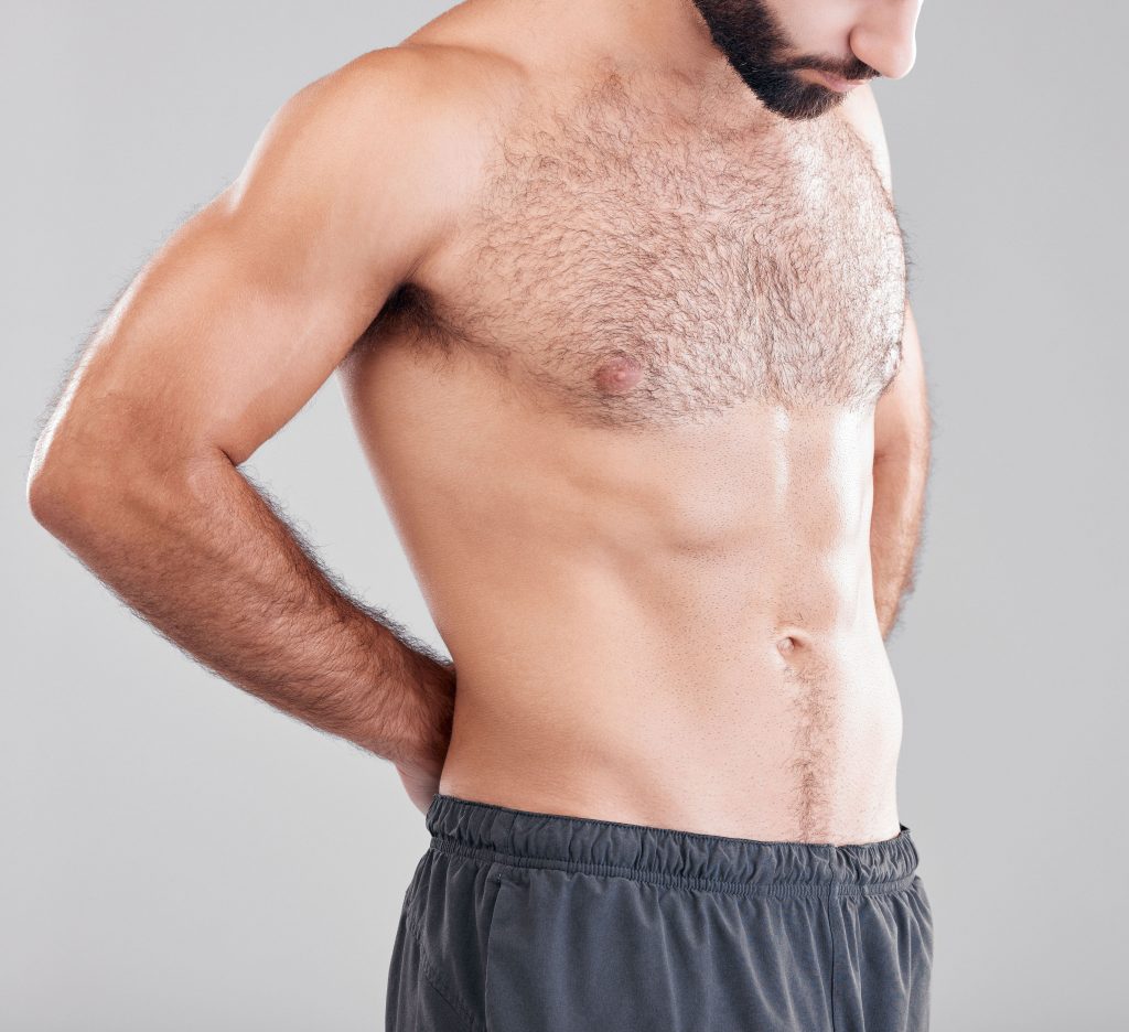 Photo of a man with a flat stomach months after liposuction