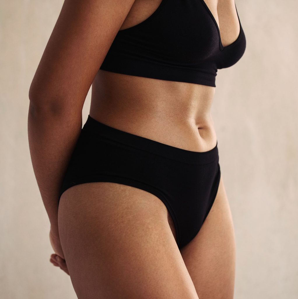 Photo of a woman's body in black underwear