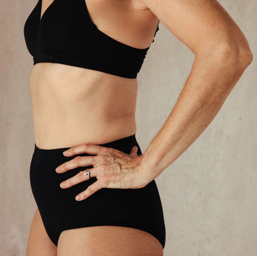 Photo of a woman's body in black underwear