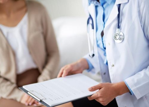 Photo of a doctor meeting with a patient